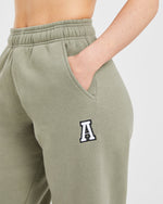 Varsity Embroidered Oversized Joggers - Muted Olive